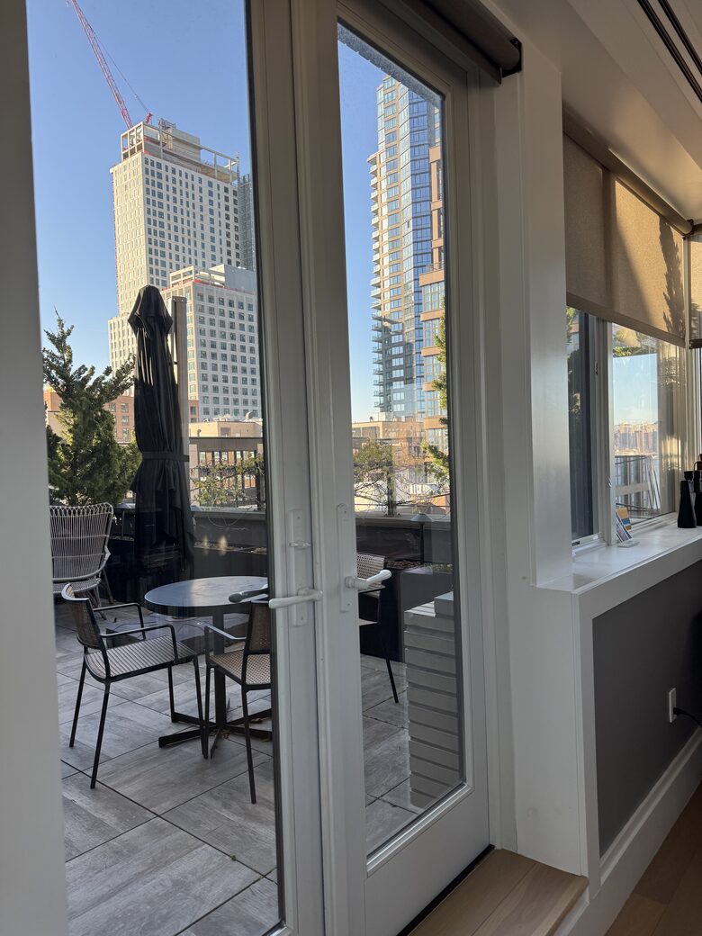 Terrace with lounges, table/chairs and grill. NYC, sunset views.