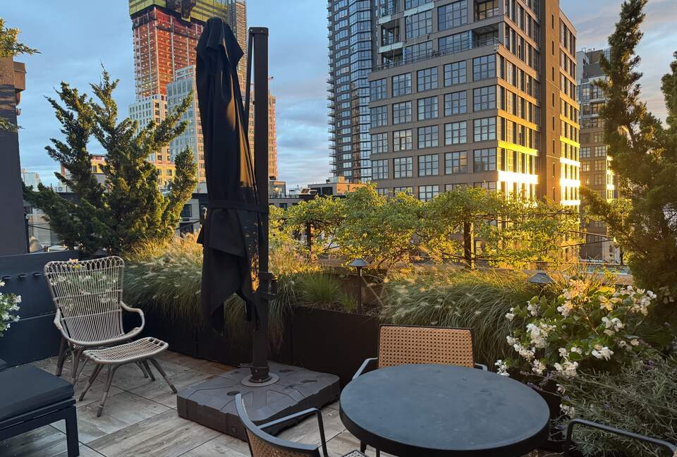 Terrace with lounges, table/chairs and grill.  NYC, sunset views.