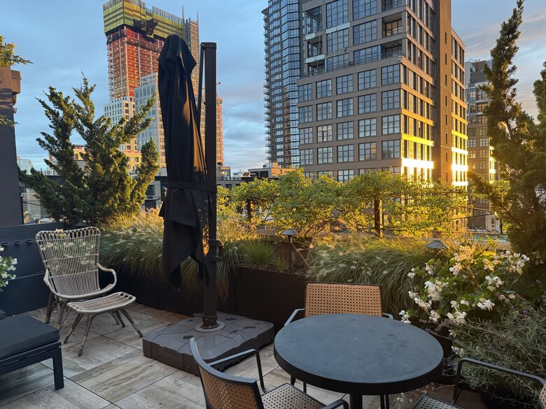 Terrace with lounges, table/chairs and grill. NYC, sunset views.