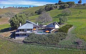 Overview of main house and poolhouse (studio behind trees)