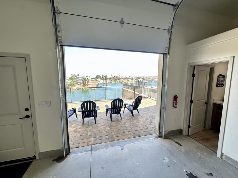 Rear of 65' garage view and lower patio/ full bathroom