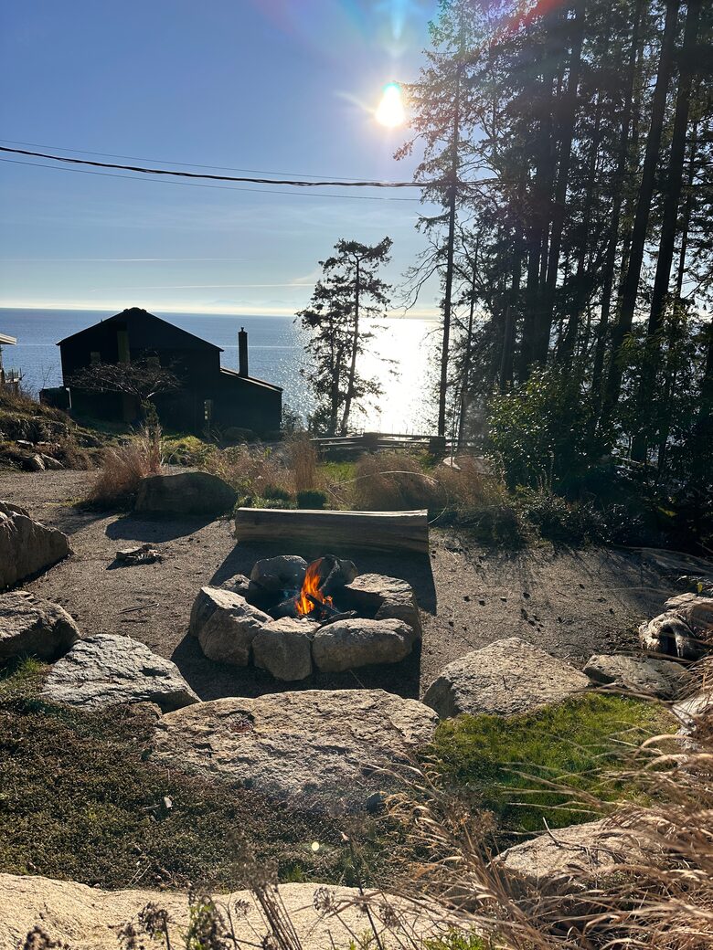 Firepit built into cliffside with views of Ocean