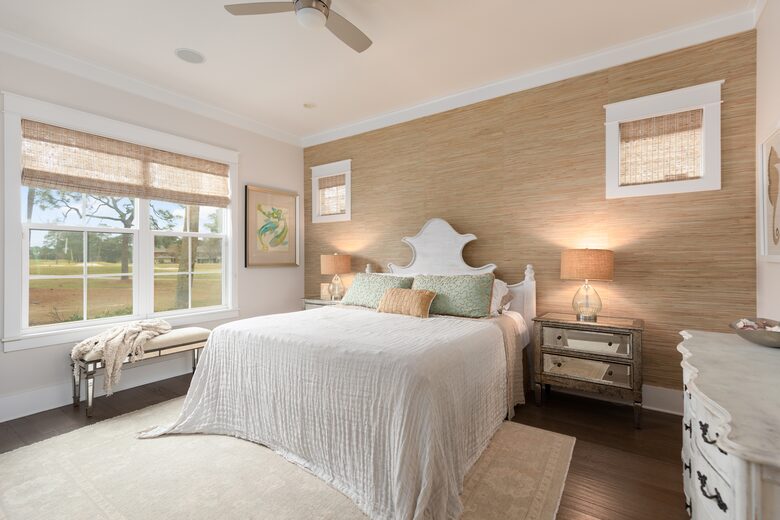 Downstairs primary bedroom with lake and golf course view.