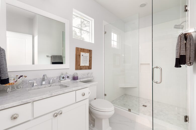 Upstairs center bedroom offers spacious custom tiled shower