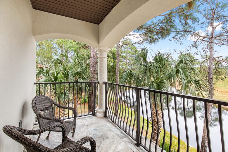 Upstairs primary bedroom with private balcony