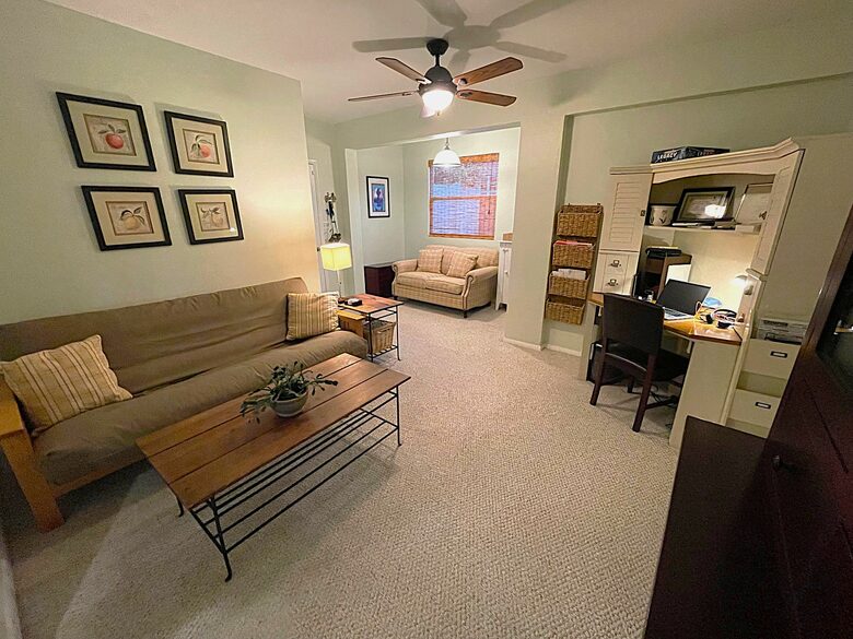 Additional room/study area and futon next to laundry room