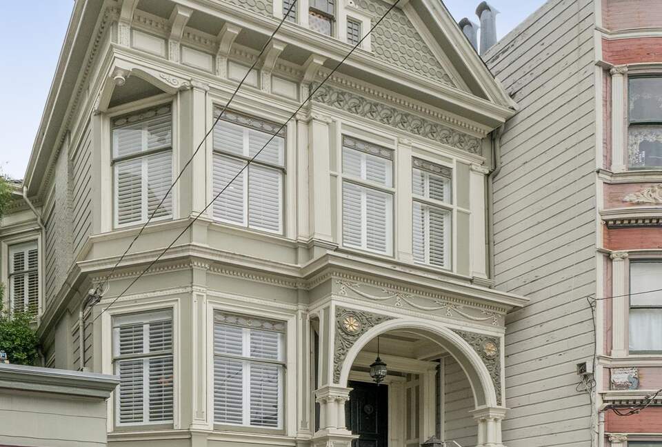 The main door at the top of a flight of stairs