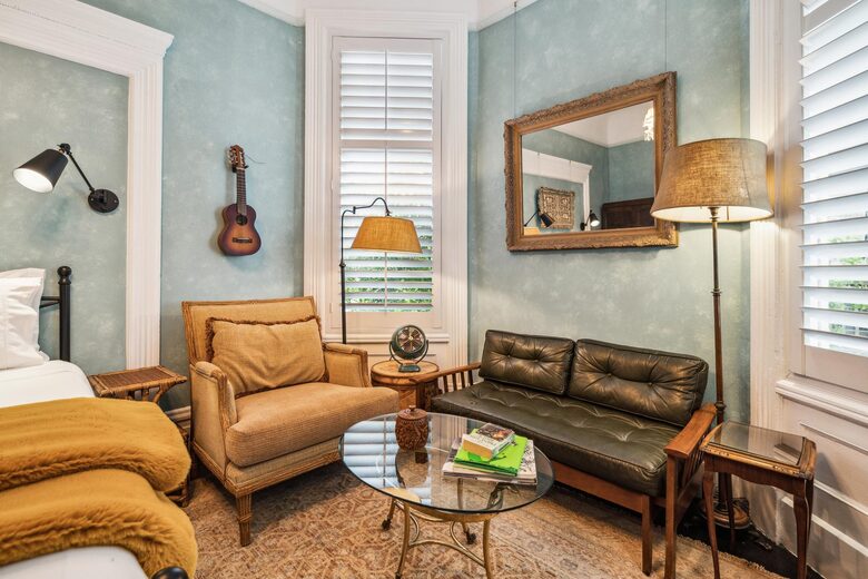 2F Solarium: A reading chair, coffee table, and a couch