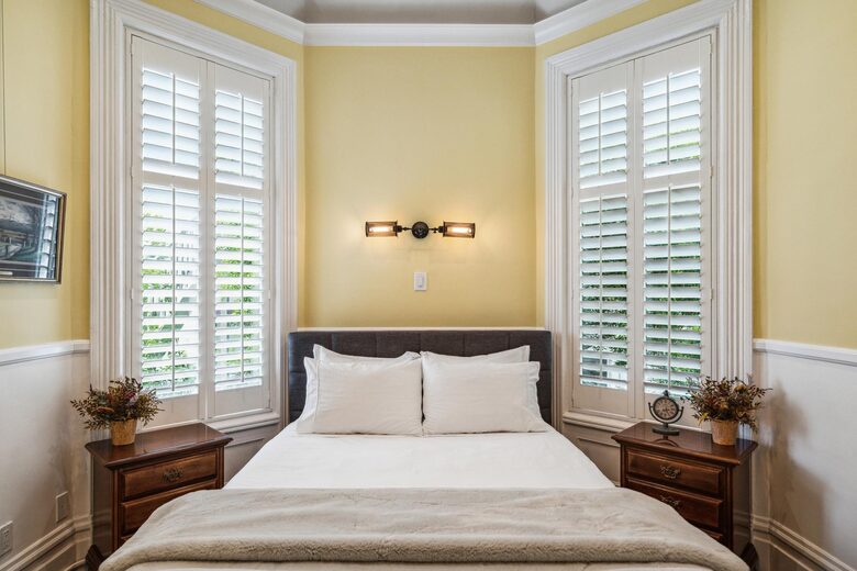 3F Sun Parlour: A queen bed and pair of nightstands