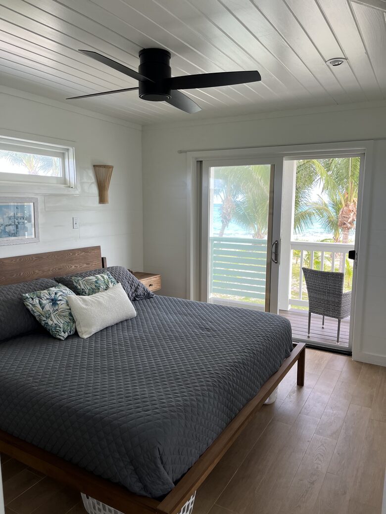 King bed overlooks the palm grove and beach