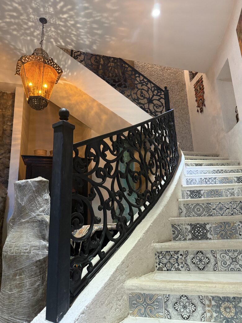 Stairs leading downward to the other bedrooms