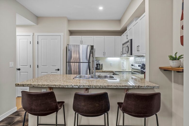 Sunlit Mountain Penthouse with Private Deck & Resort Amenities - Canmore, Canada