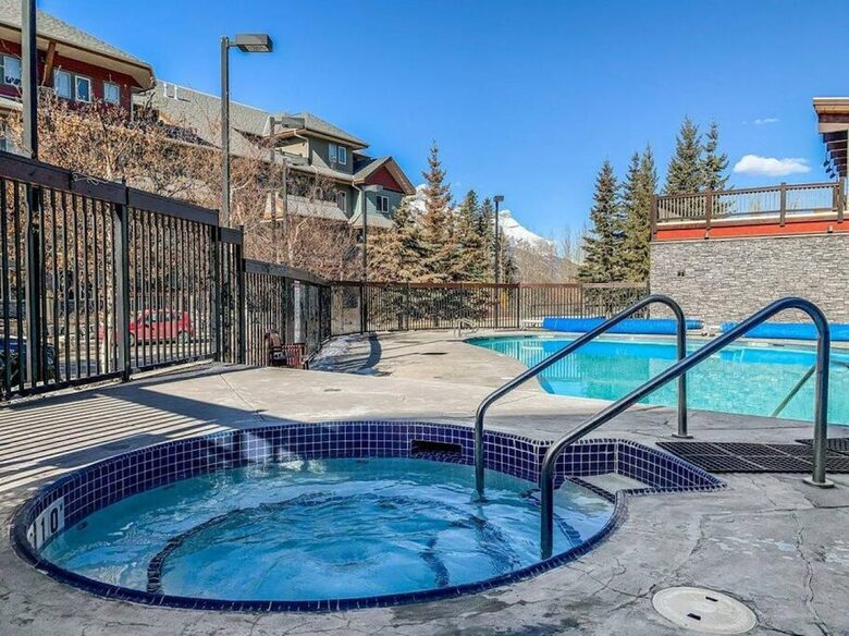 Sunlit Mountain Penthouse with Private Deck & Resort Amenities - Canmore, Canada