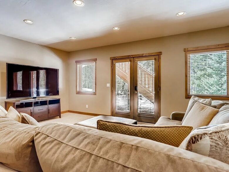 Downstairs TV/relax room with access to patio
