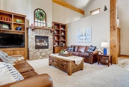 Living room with TV and fireplace