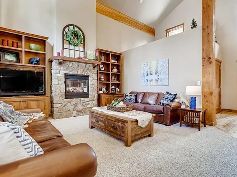 Living room with TV and fireplace