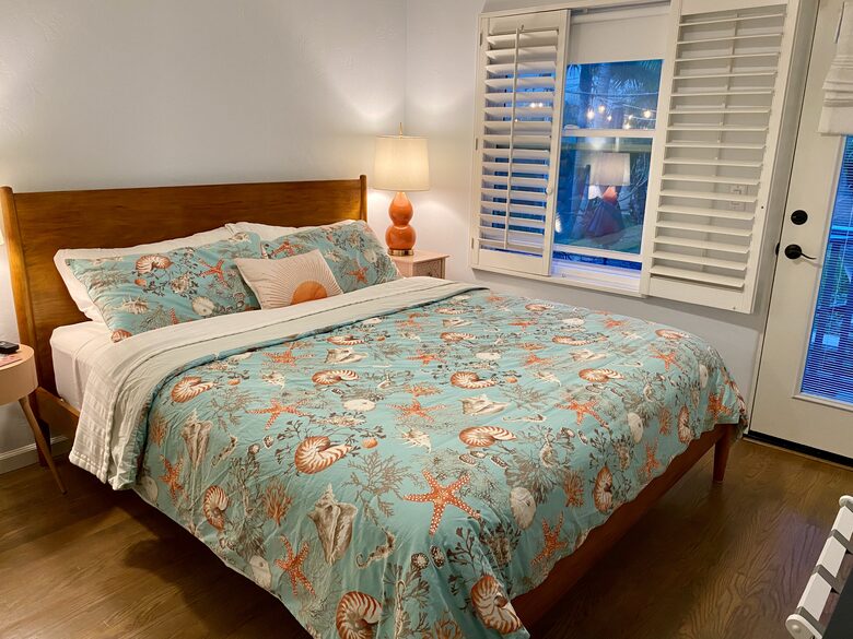King bedroom with door to backyard. Large closet with built-ins.