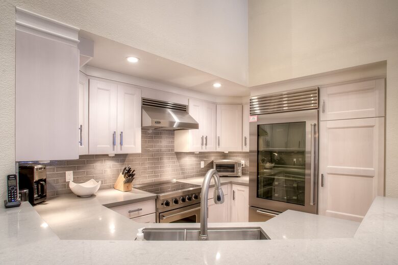 Fully stocked high end kitchen. Microwave located in pantry.