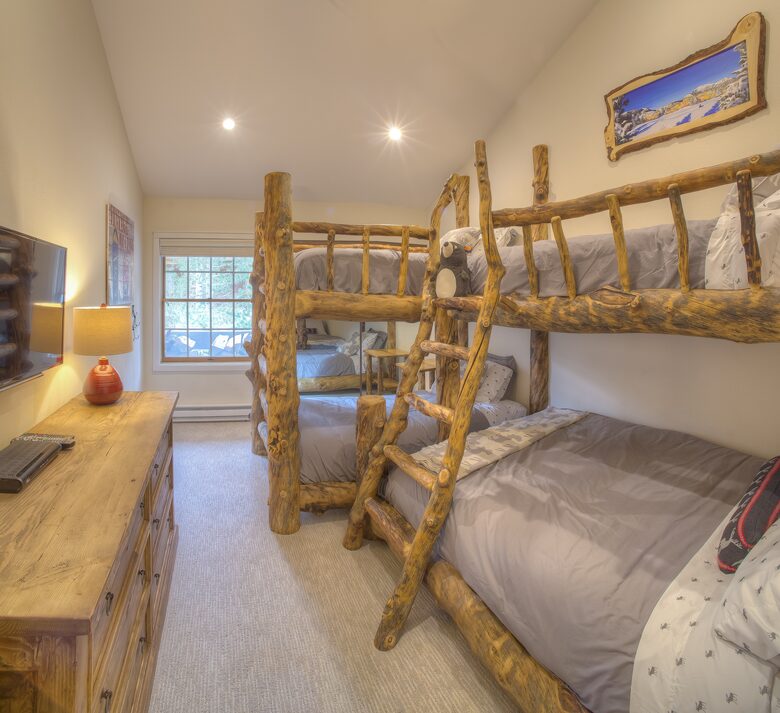 Custom bunkroom with queen and 3 twins