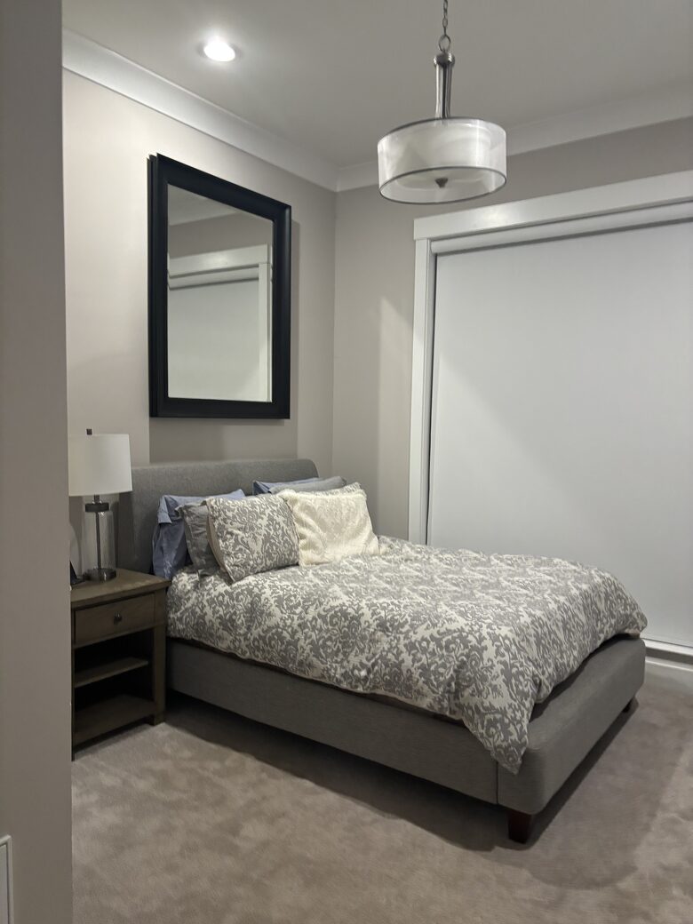 Downstairs bedroom with queen and bathroom with shower
