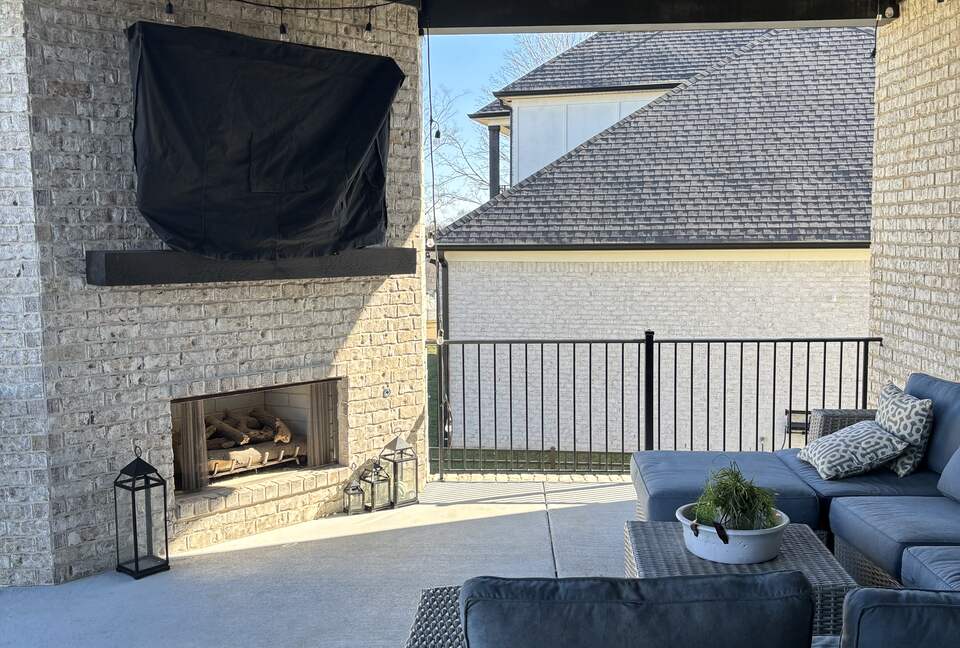 Upper patio with fireplace and TV