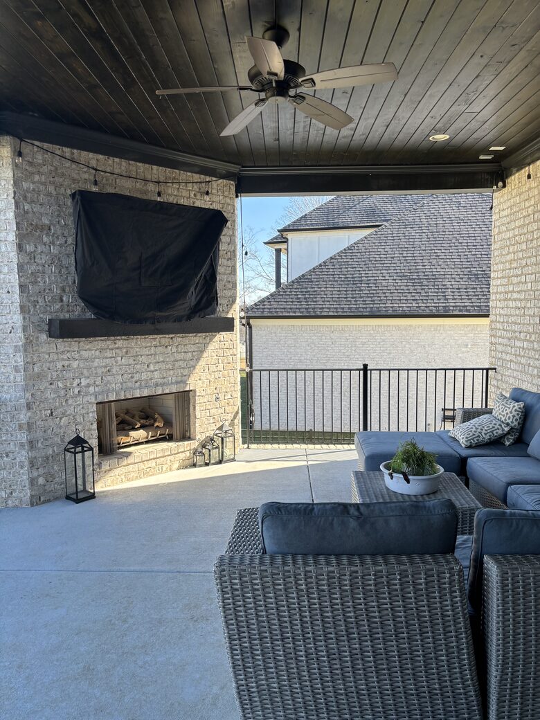 Upper patio with fireplace and TV