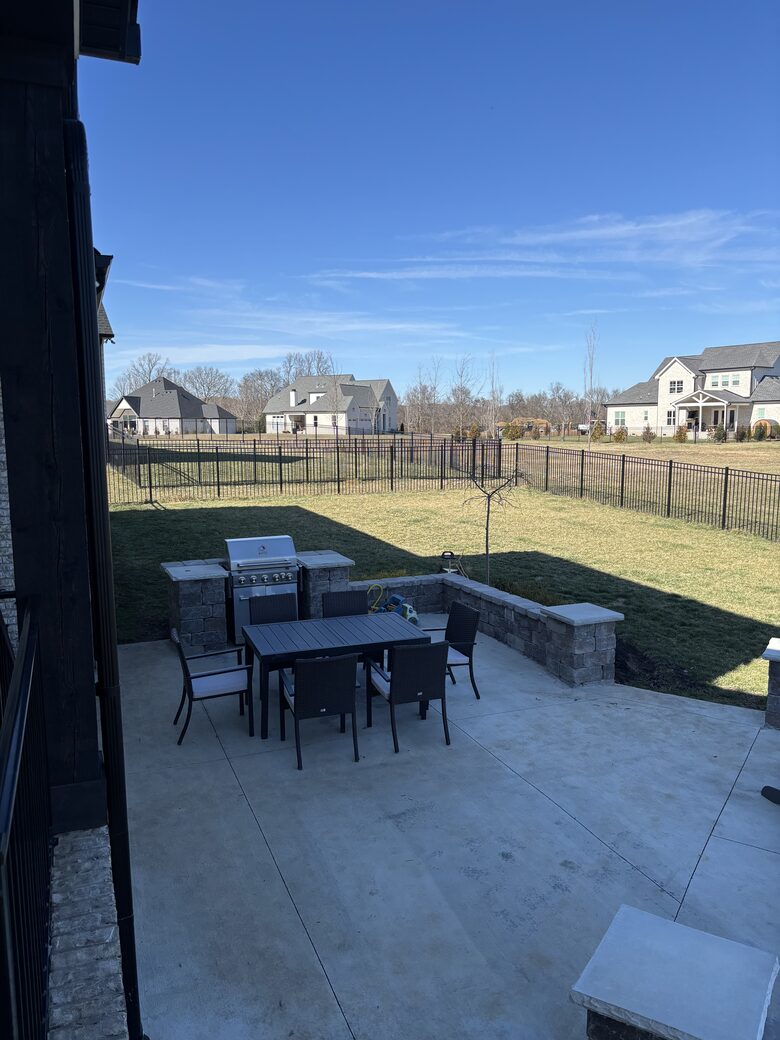 Lower patio with dining table and BBQ