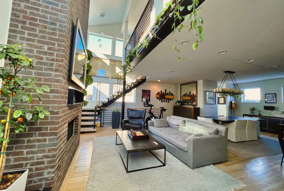 View of the living room from the home entrance (Peleton not included i