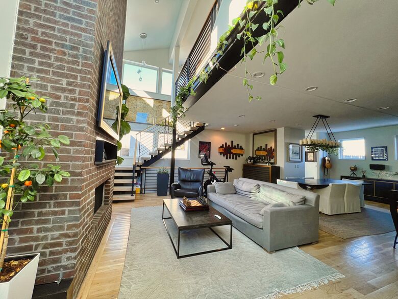View of the living room from the home entrance (Peleton not included i
