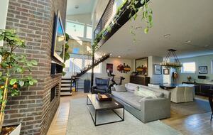 View of the living room from the home entrance (Peleton not included i