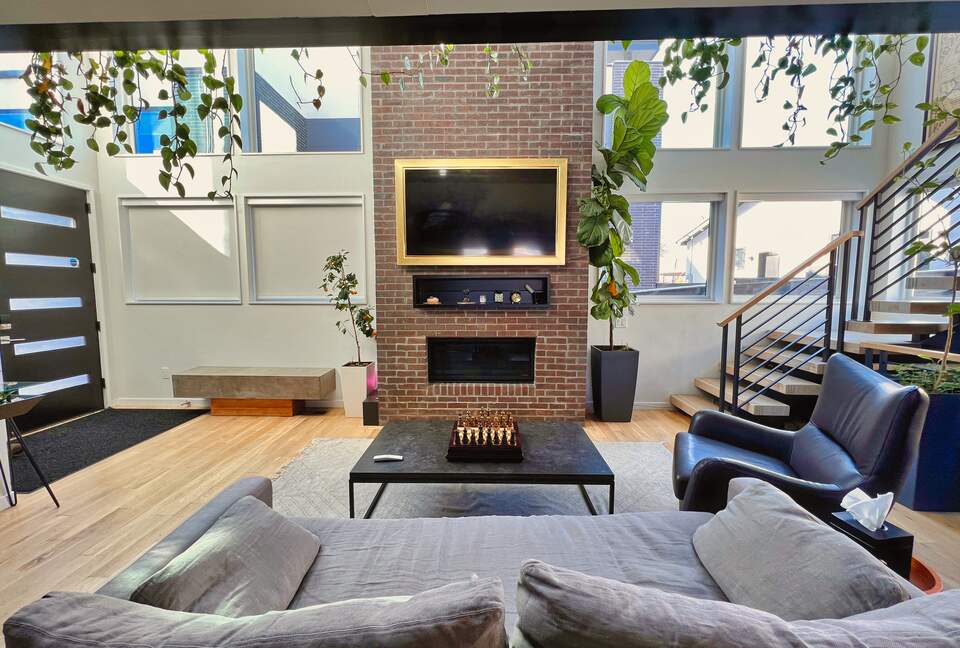 View of the frame tv from behind living room sofa
