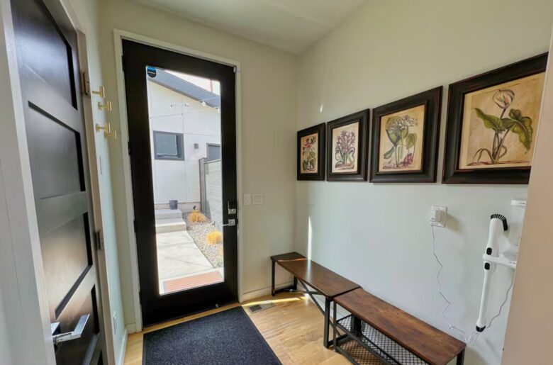 Another view of seating area by door leading to backyard. On the left