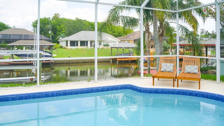 Stylish Waterfront Getaway with Pool, Spa & Boat lift and Dock in Palm Coast Florida - Palm Coast, Florida