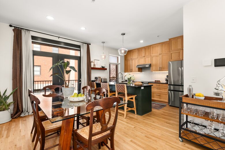 A view of the kitchen & dining rooms
