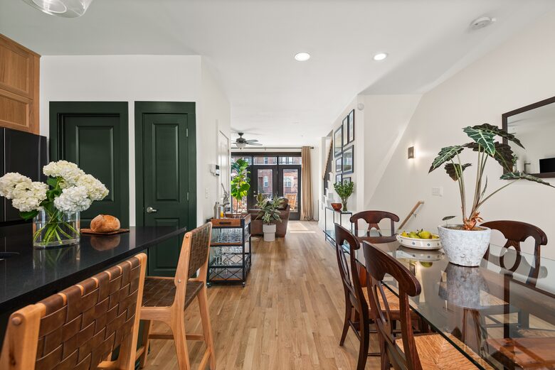 A look across the hall to the balcony and living room
