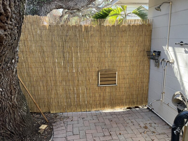 Outdoor shower and courtesy bench.