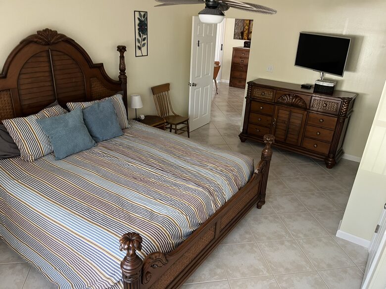 Master bedroom with flat screen.
