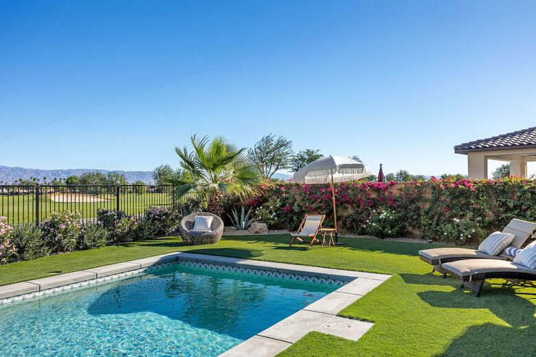 Lush green yard with pool and spa overlooking Stadium, PGA WEST