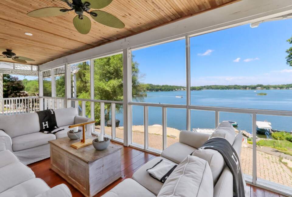 Amazing view of the lake with screened in porch