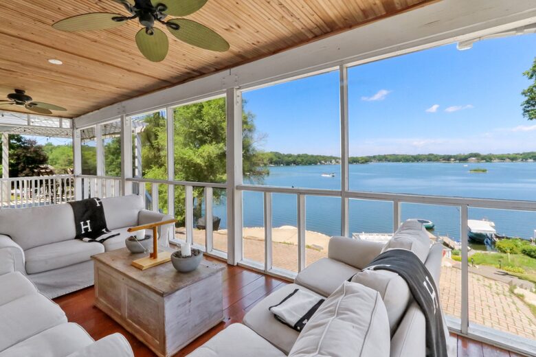 Amazing view of the lake with screened in porch