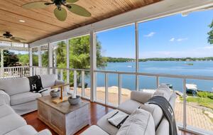 Amazing view of the lake with screened in porch