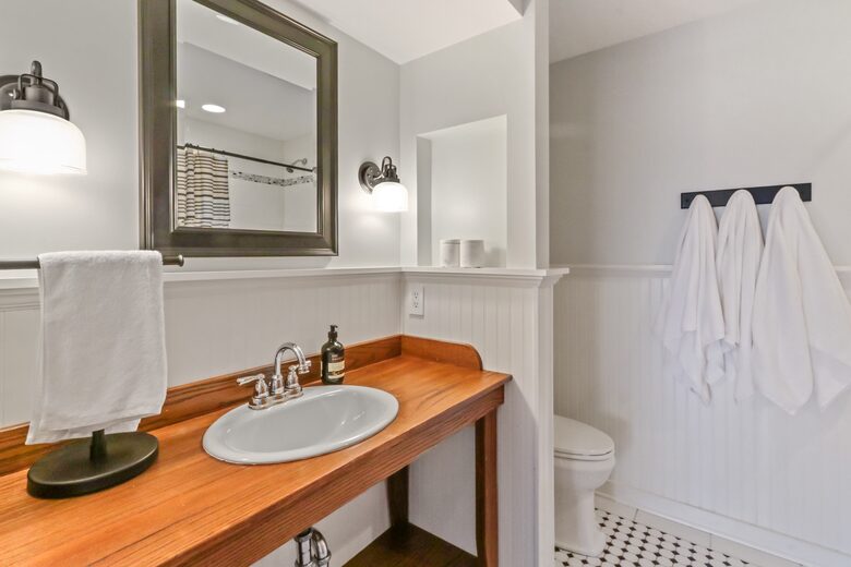 Second floor bathroom with sink, toilet, shower/tub combo