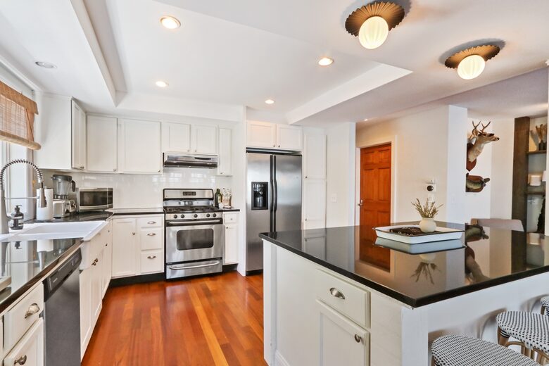 Large open kitchen with stainless steel appliances