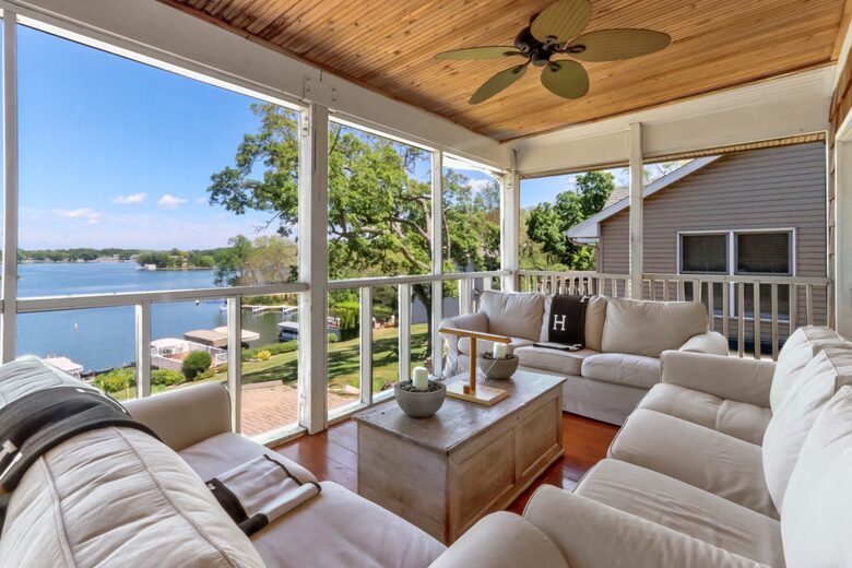 Amazing view of the lake with screened in porch