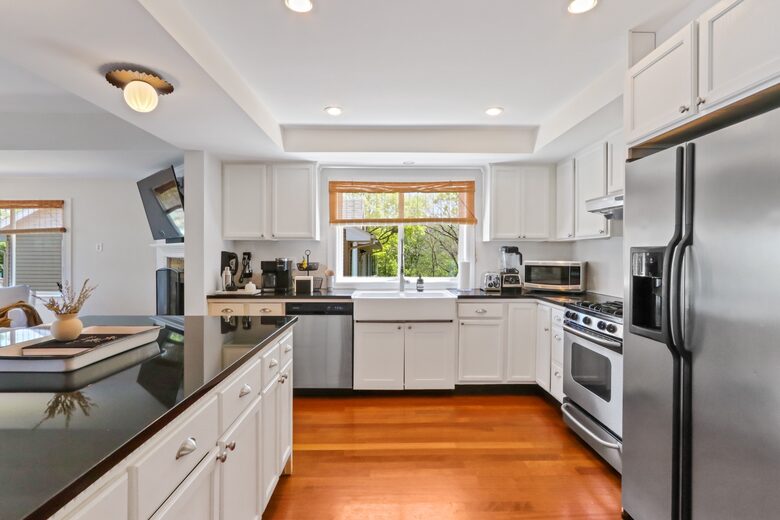 Large open kitchen with stainless steel appliances