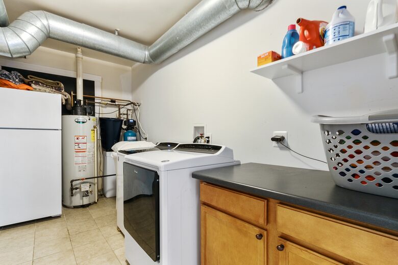 First floor laundry room with washer and dryer