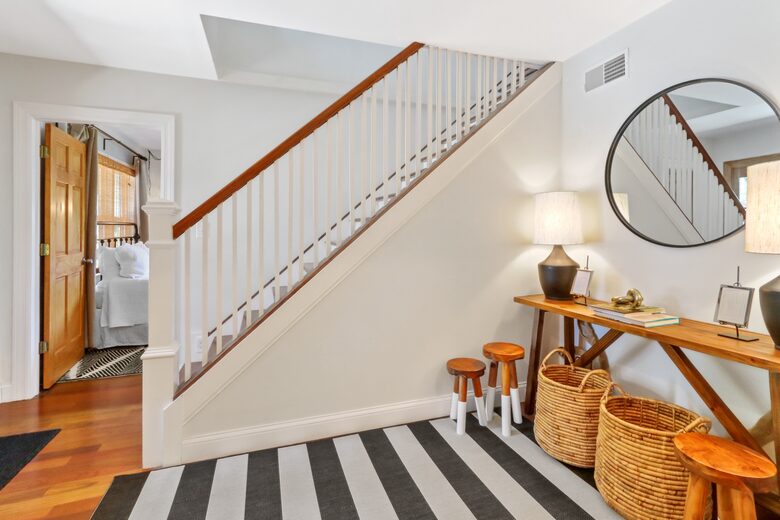 Staircase to second floor and entry to house