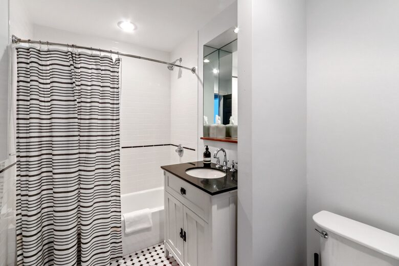 First floor Master en suite sink, toilet, shower/tub combo