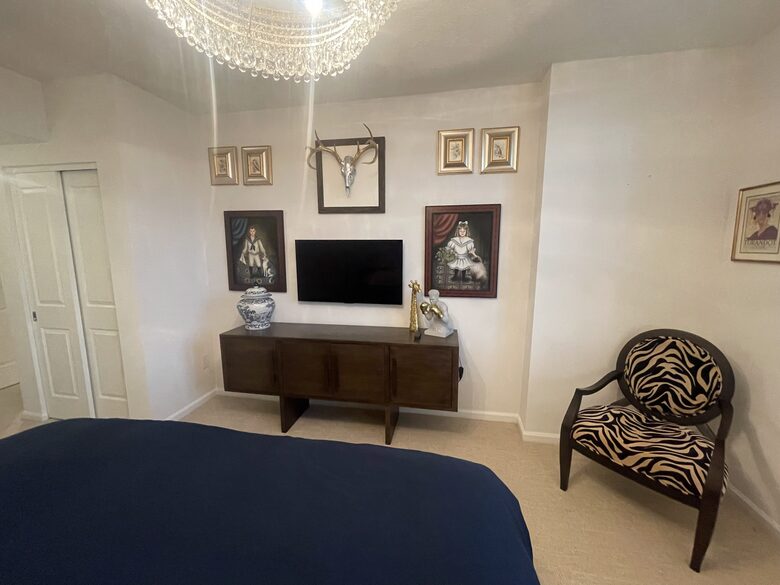 Master bedroom tv and artwork