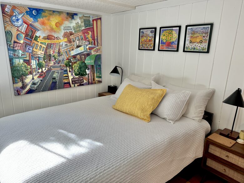 The queen bed in the Rainbow room (basement)
